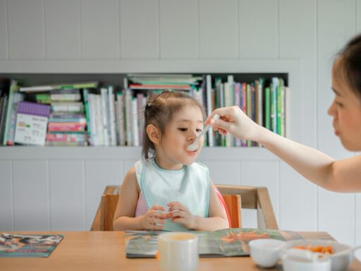 woman holding white plastic spoon