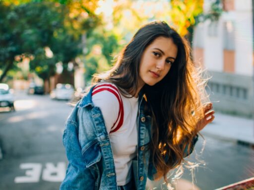 woman sitting on metal railings