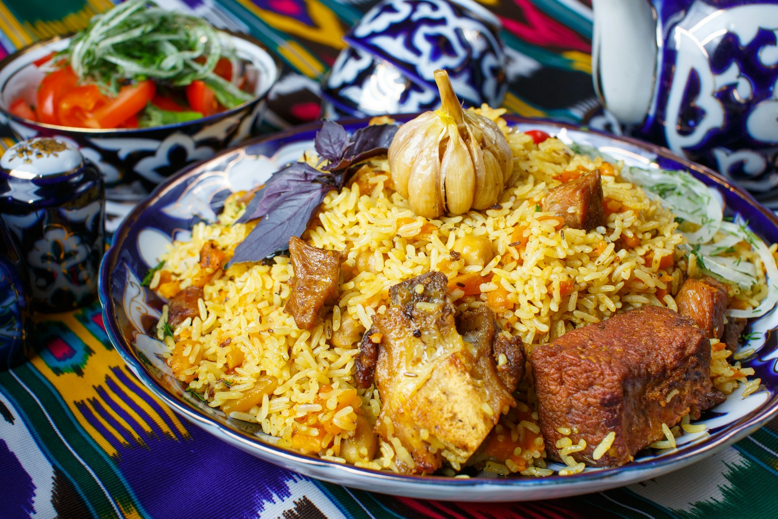 a plate of rice with meat and vegetables