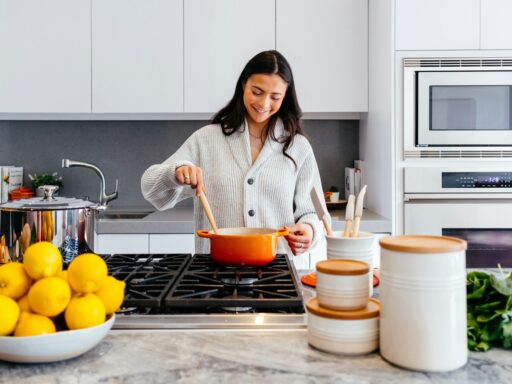 woman cooking inside kitchen room